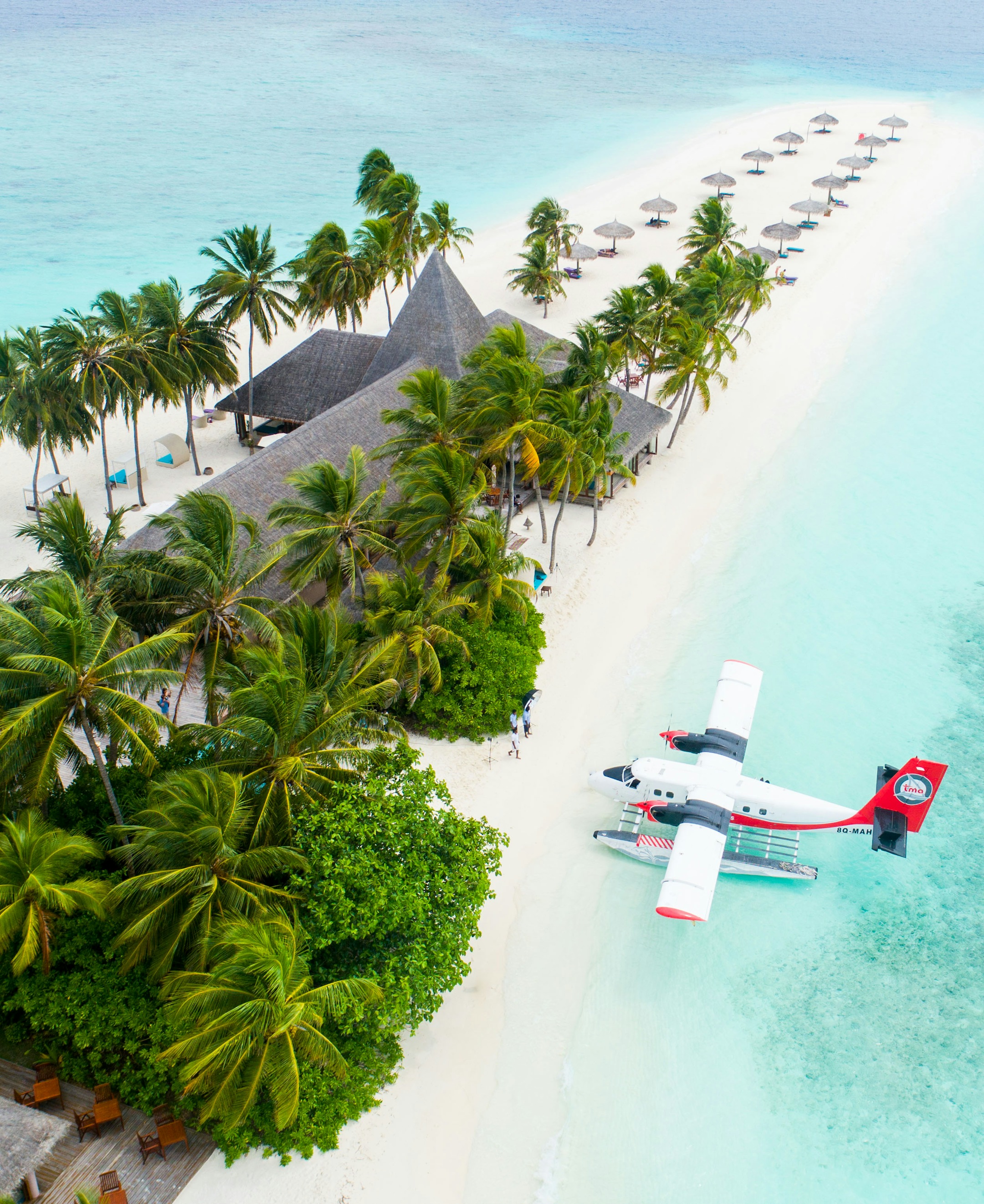 Maldives Luxury Catamaran Tour - Vertical drone shot of isolated pristine white sandbank surrounded by 50 shades of turquoise blue ocean