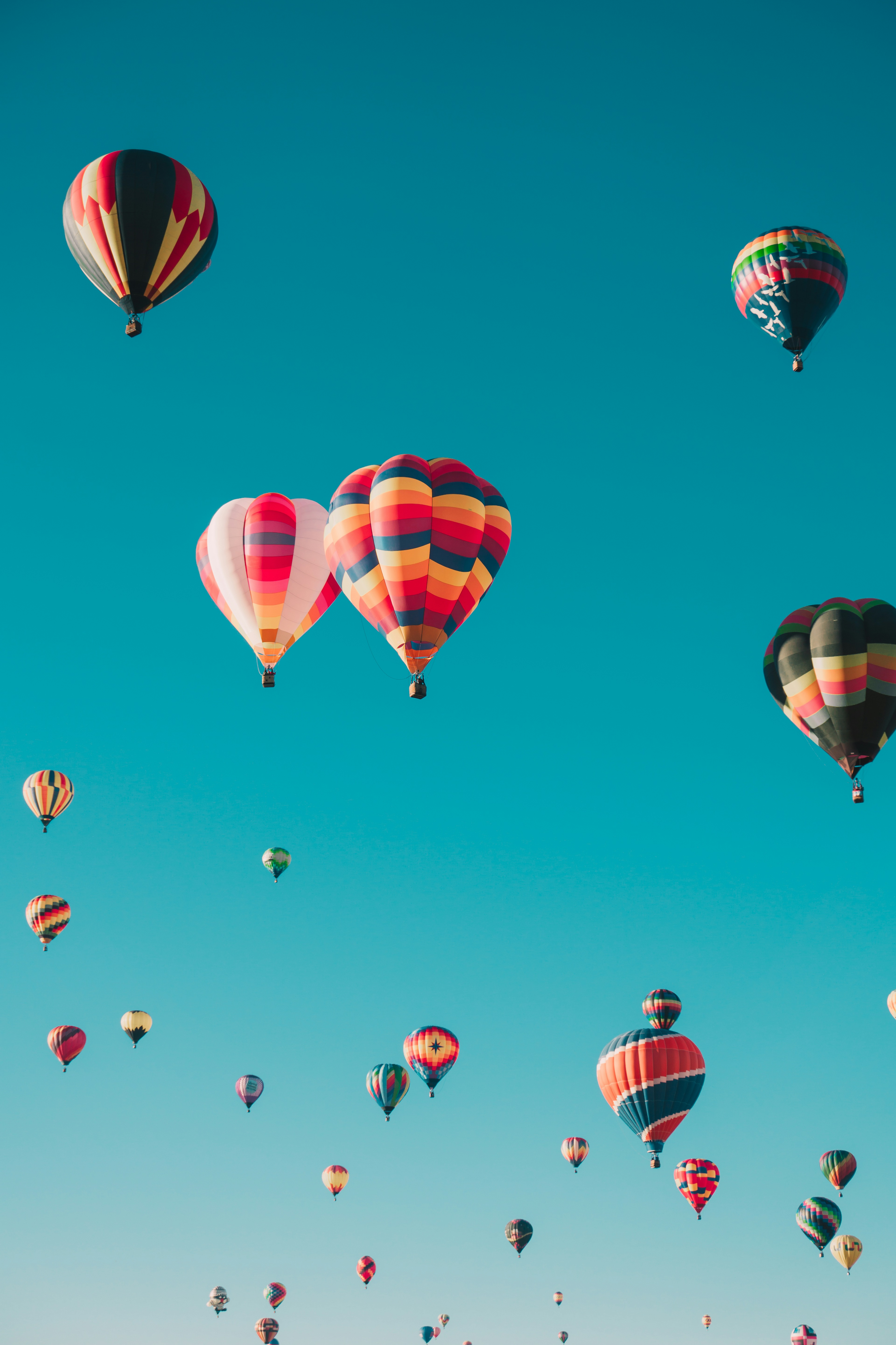 Serengeti Balloon Safari - Colorful hot air balloon drifting over the vast golden savannah of the Serengeti at dawn